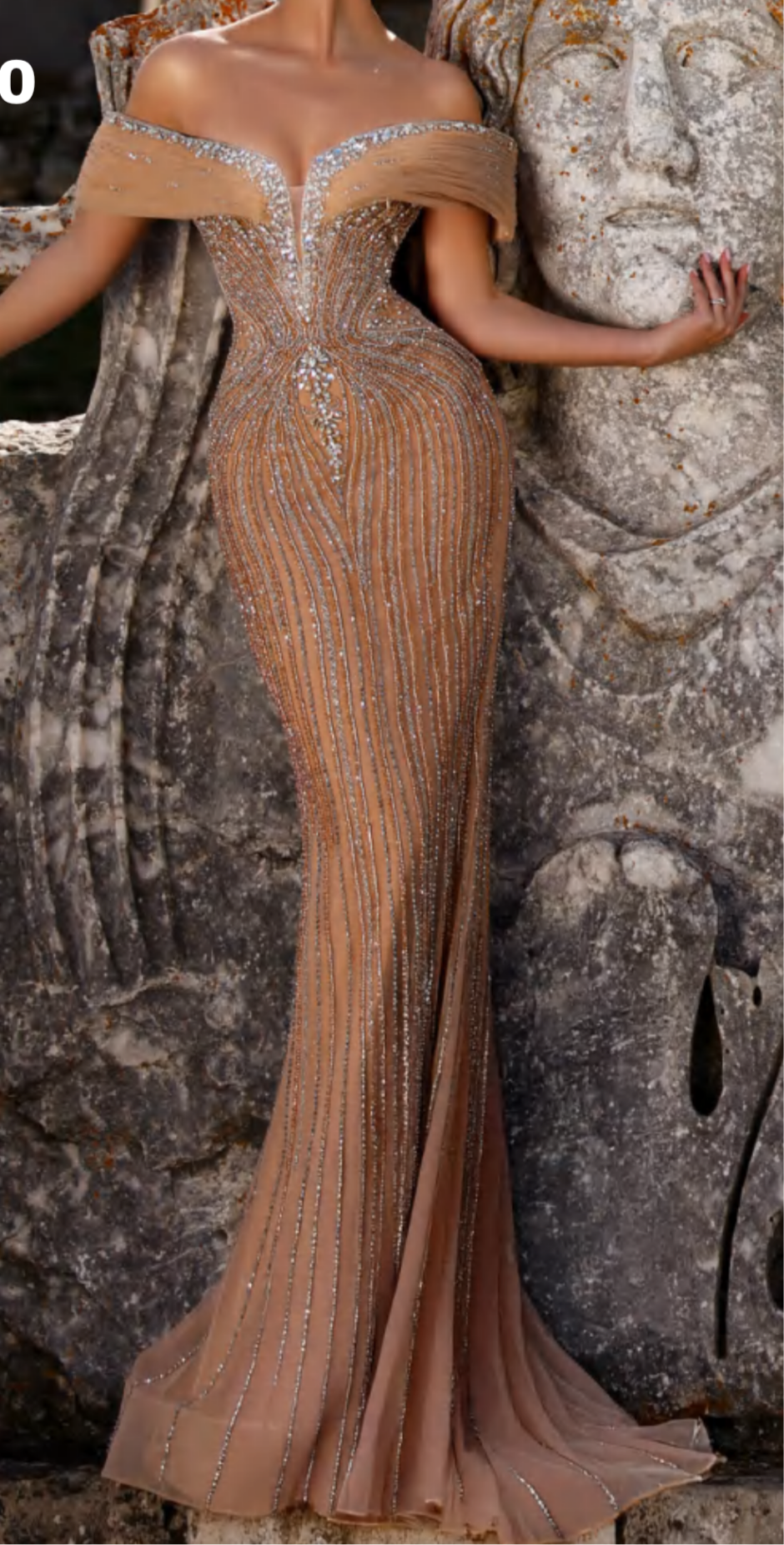 Elegant luxurious dress embellished with crystals and gemstones, featuring off-shoulder design.”