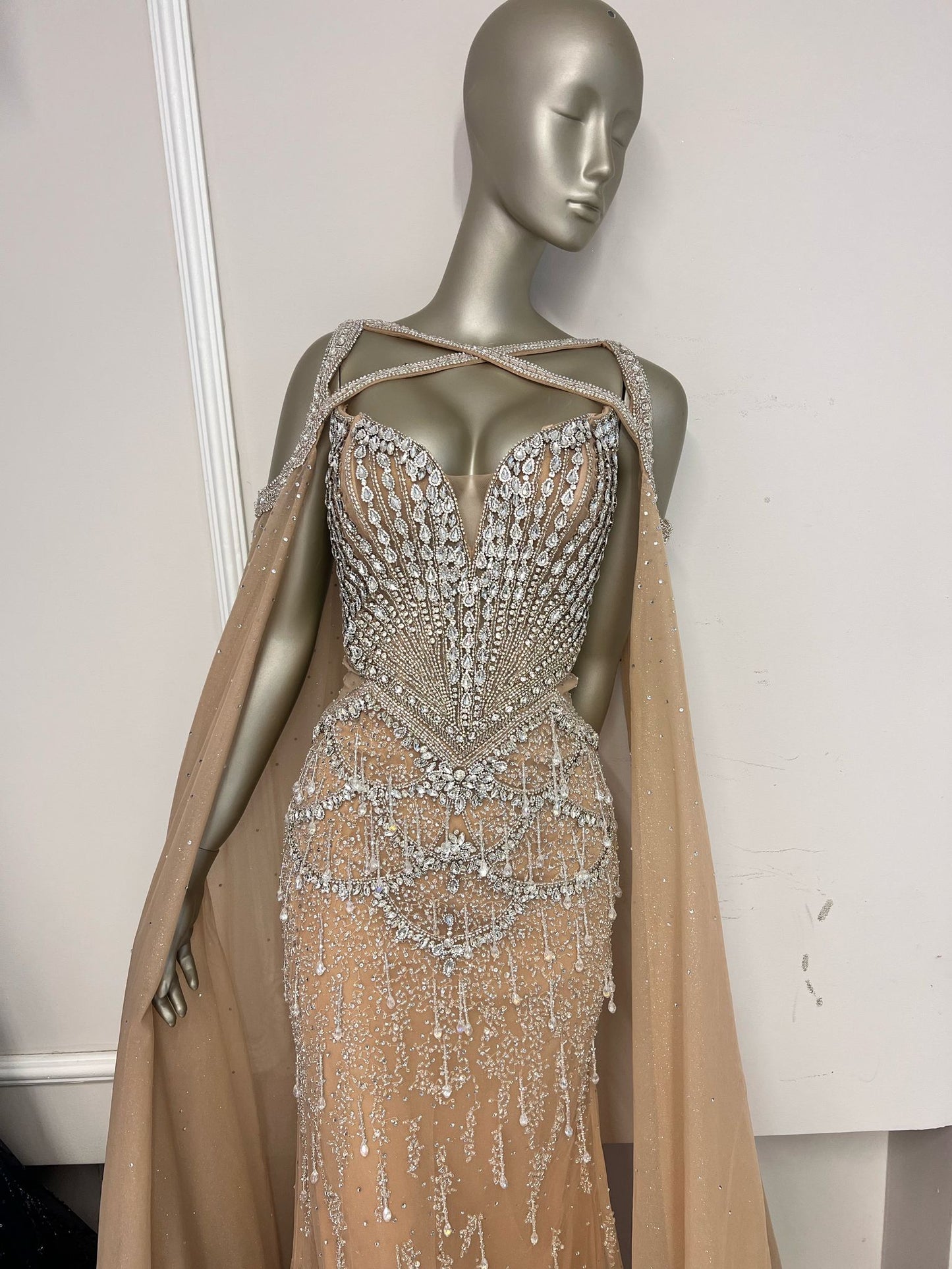 Elegant dress embellished with rhinestones, featuring long sleeves