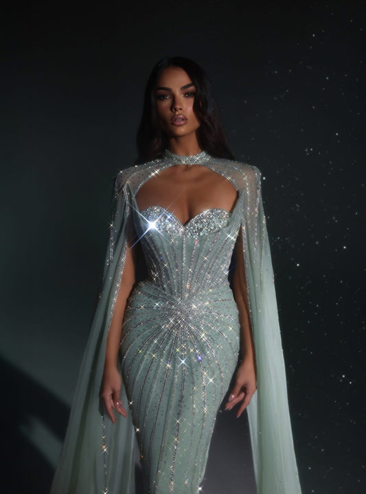 An elegant party dress with long sleeves and a unique design.