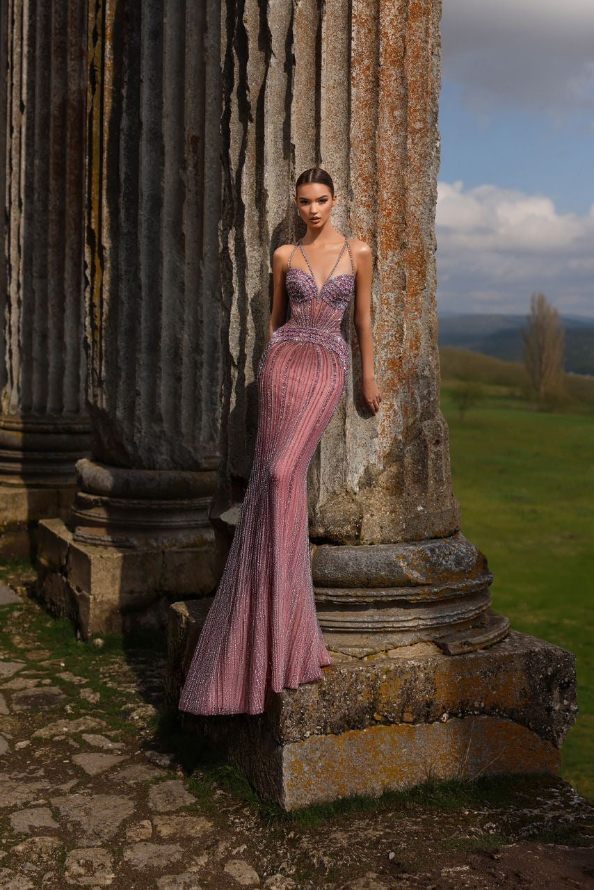 “Elegant and luxurious dress adorned with gemstones and crystals, featuring attractive colors.”