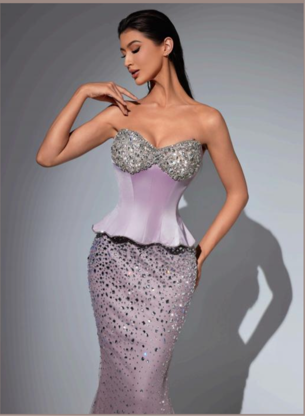 Elegant mermaid dress adorned with scattered crystals.