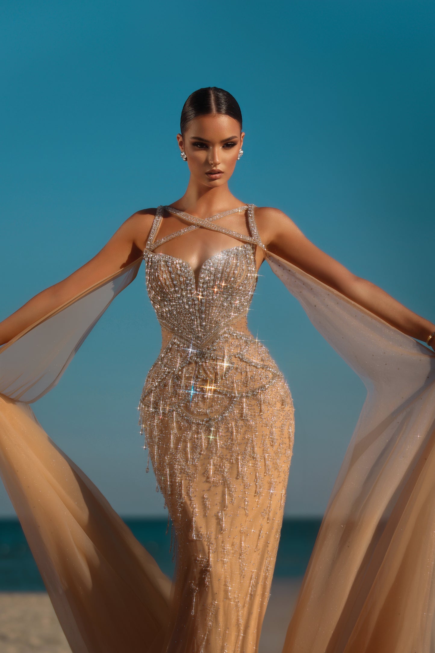 Elegant dress embellished with rhinestones, featuring long sleeves