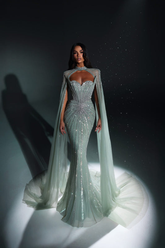 An elegant party dress with long sleeves and a unique design.