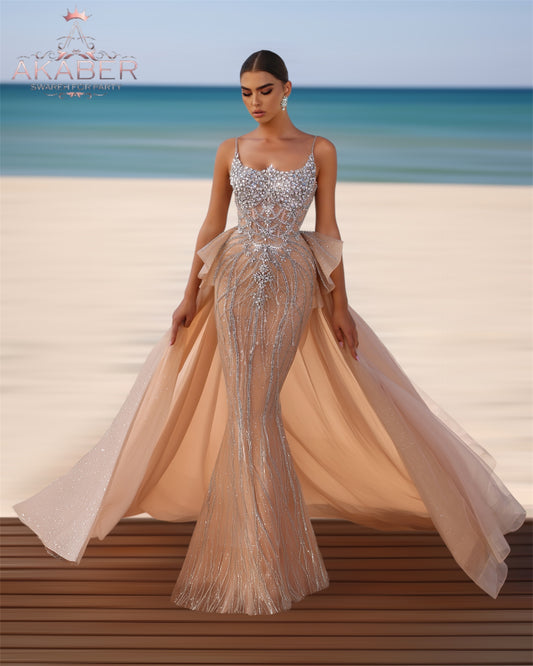 Luxurious dress adorned with gemstones, featuring a long train at the back.”