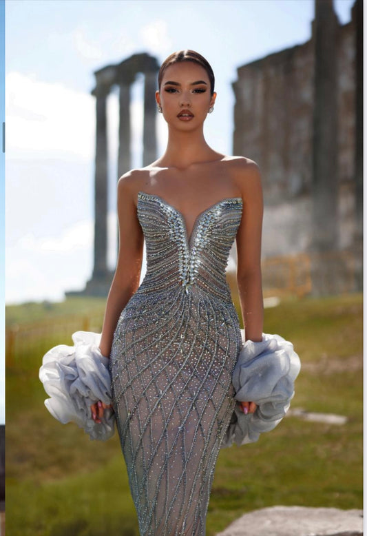 Luxury dress beautifully embroidered with stones, featuring two pieces on the sleeves